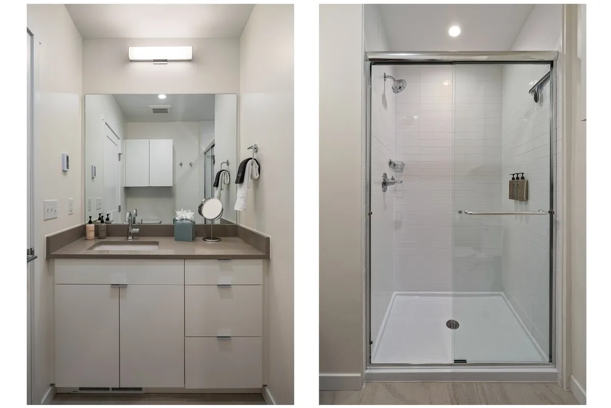 A refreshing and modern bathroom with a well-lit vanity sink, a sleek mirror, and a glass-enclosed shower. The space feels clean, spa-inspired, and perfect for self-care routines.